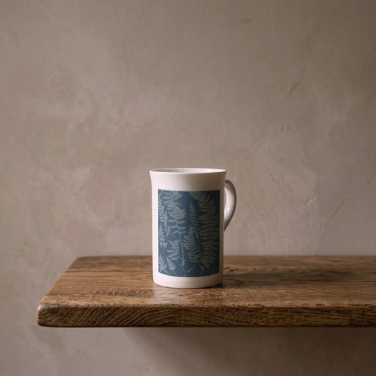 Anna Atkins: Cyanotype Ferns, 1840s – porcelain art mug on an oiled oak shelf against a limewashed wall