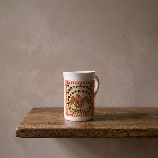 Eagle Quilt: Twenty-Six Stars, 1837 – porcelain art mug on an oiled oak shelf against a limewashed wall