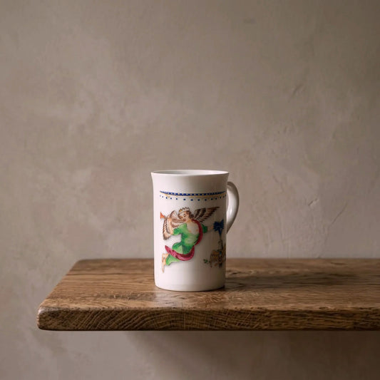 George Washington's Coffee Cup, 1784 – porcelain art mug on an oiled oak shelf against a limewashed wall