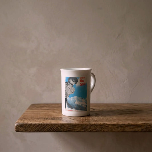 Hans Aeschbach: Swiss Alps Calling, 1951 – porcelain art mug on an oiled oak shelf against a limewashed wall