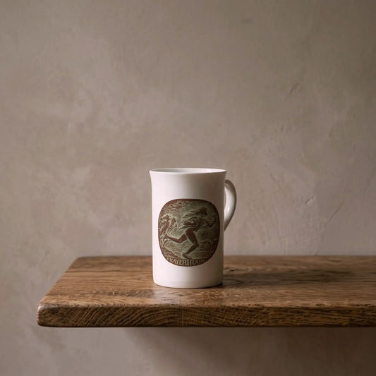 Hermon Atkins MacNeil: Hopi — Prayer for Rain, 1931 – porcelain art mug on an oiled oak shelf against a limewashed wall