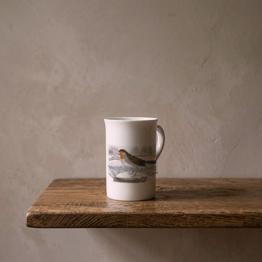 Thomas Bewick: The Redbreast, 1797 – porcelain art mug on an oiled oak shelf against a limewashed wall