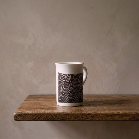 Wilson Bentley: Dew on a Spider Web, c. 1910 – porcelain art mug on an oiled oak shelf against a limewashed wall