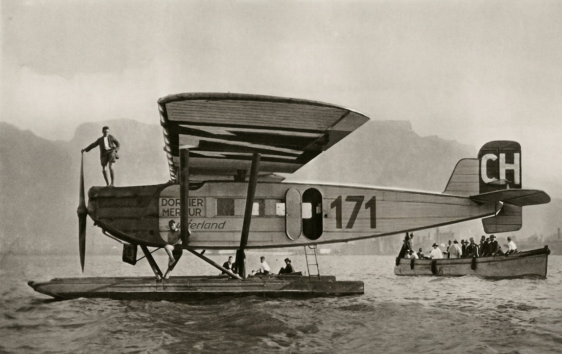 The seaplane «Switzerland» on the water at Cape Town, 1927, a man standing on its nose