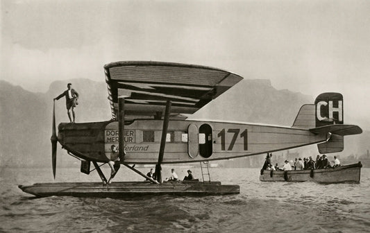The seaplane «Switzerland» on the water at Cape Town, 1927, a man standing on its nose