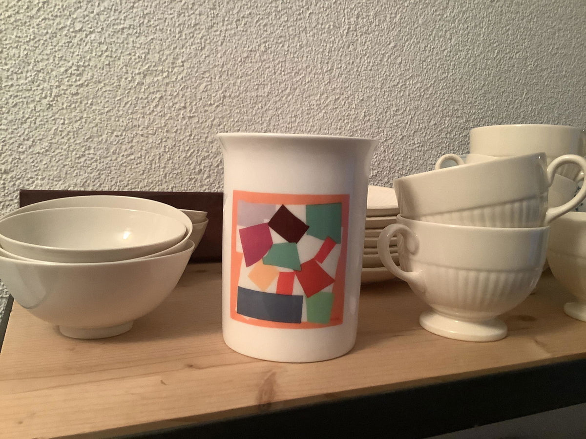 Henri Matisse: The Snail porcelain mug at a customer's home in Switzerland, among white tableware on a shelf