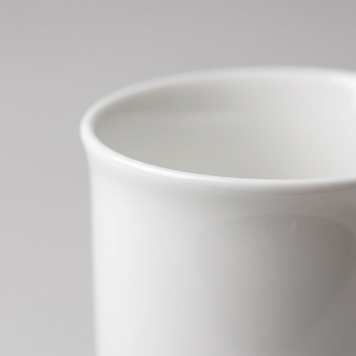 Fine porcelain mug, close-up of the thin, smooth rim