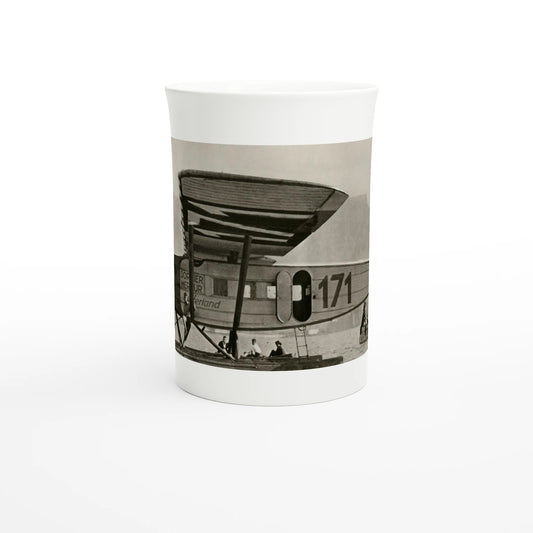 Porcelain mug, front view: the seaplane «Switzerland» on the water at Cape Town, the photograph running around the body