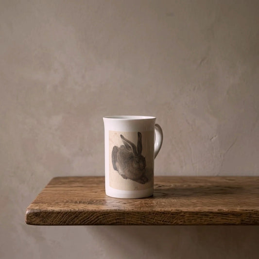 Albrecht Dürer: Young Hare, 1502 – porcelain art mug on an oiled oak shelf against a limewashed wall