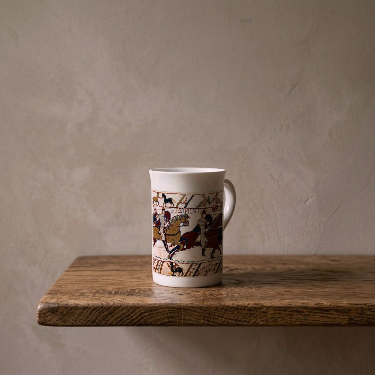 Bayeux Tapestry: The Norman Charge at Hastings, 1066 – porcelain art mug on an oiled oak shelf against a limewashed wall