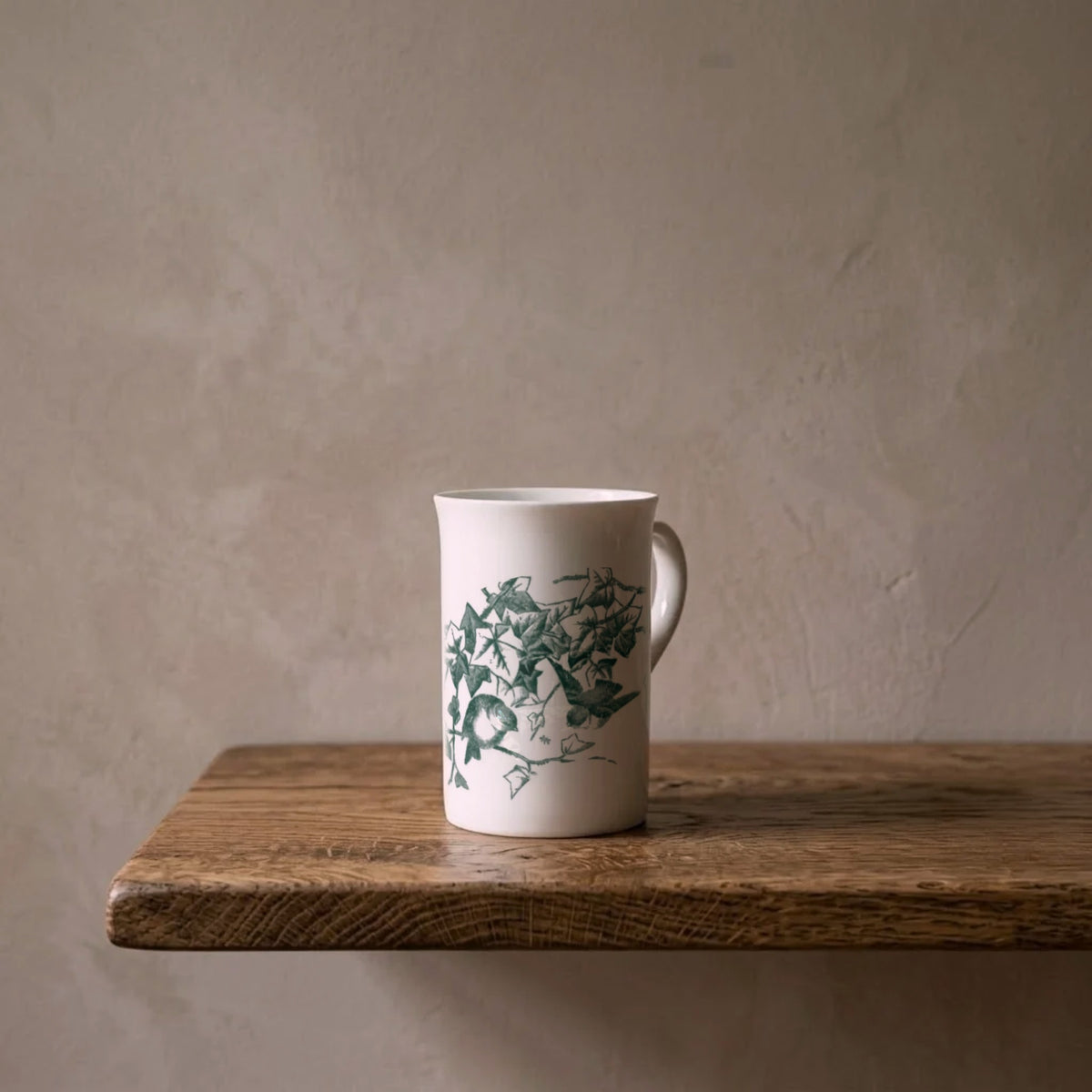 Ivy Bower – porcelain art mug on an oiled oak shelf against a limewashed wall