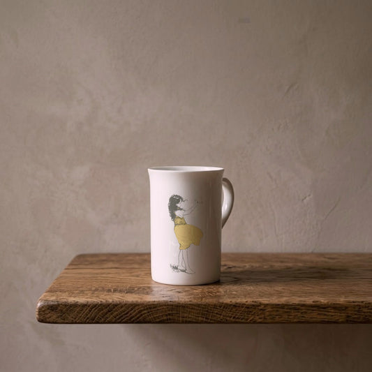 Heidi Waving – porcelain art mug on an oiled oak shelf against a limewashed wall