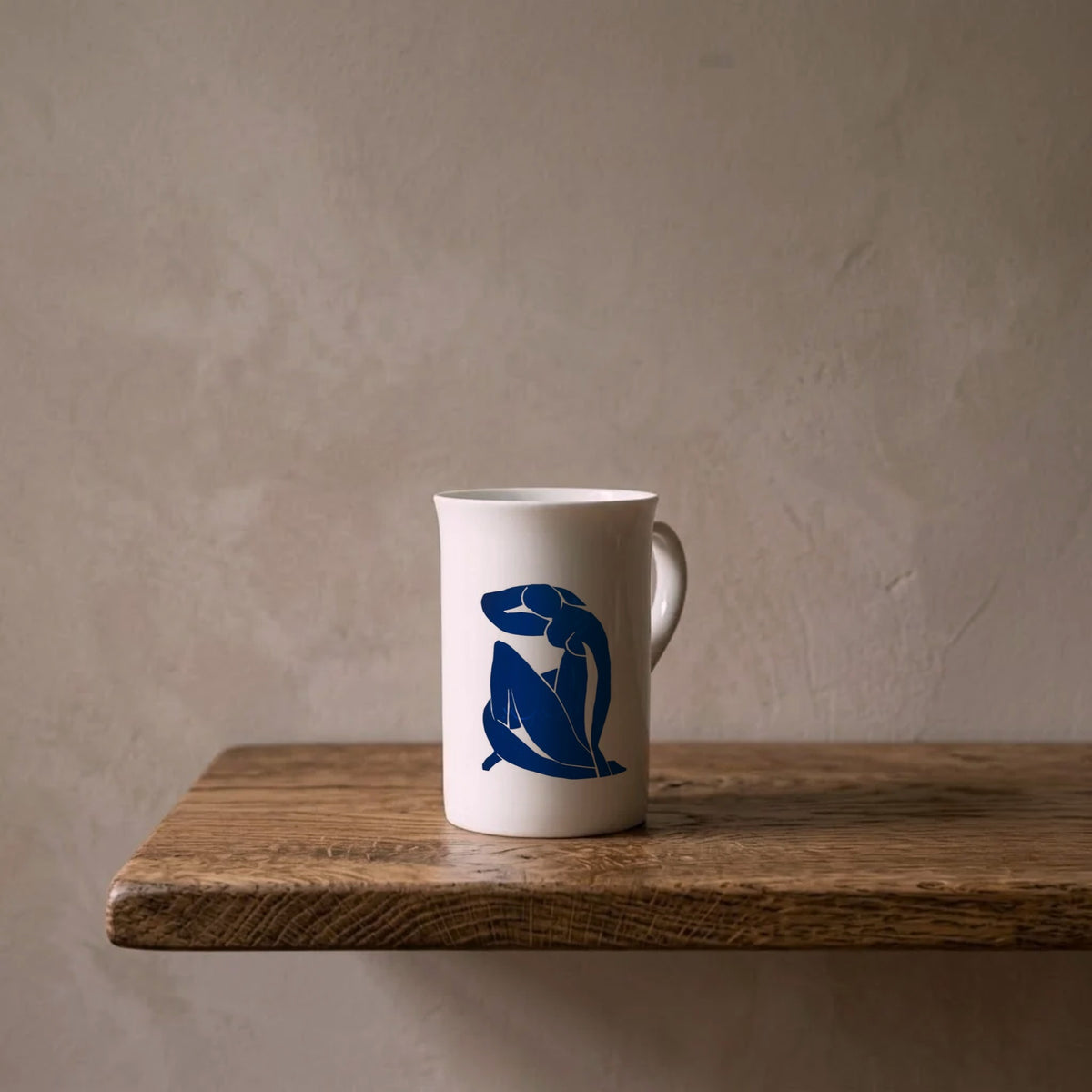 Henri Matisse: Blue Nude II, 1952 – porcelain art mug on an oiled oak shelf against a limewashed wall