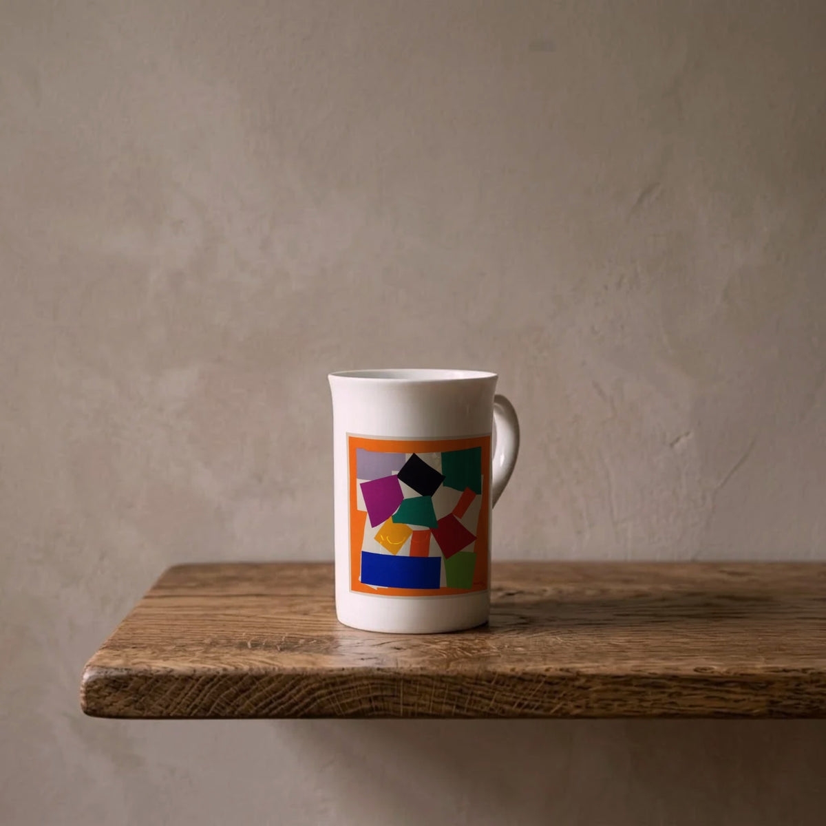 Henri Matisse: The Snail, 1953 – porcelain art mug on an oiled oak shelf against a limewashed wall