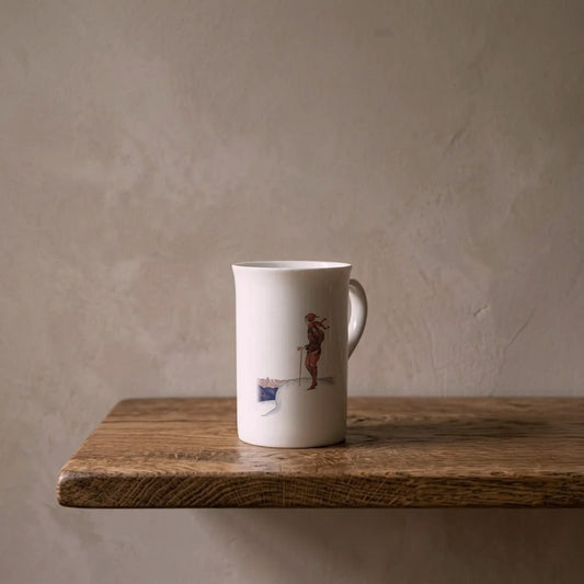 R. Rahl: Auf der Höhe – porcelain art mug on an oiled oak shelf against a limewashed wall