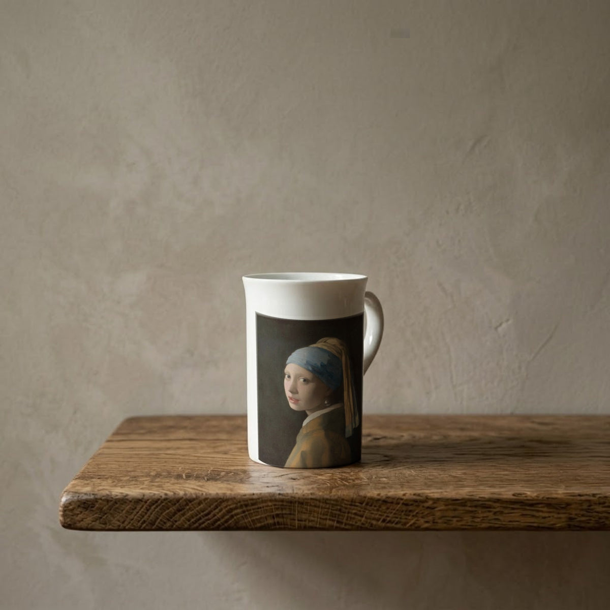 Johannes Vermeer: Girl with a Pearl Earring, c. 1665 – porcelain art mug on an oiled oak shelf against a limewashed wall