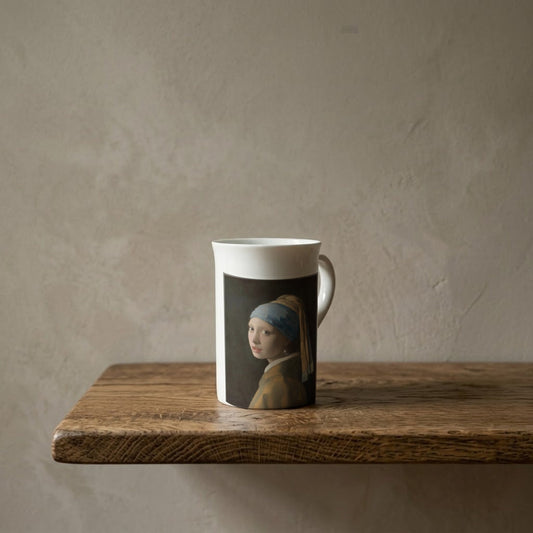 Johannes Vermeer: Girl with a Pearl Earring, c. 1665 – porcelain art mug on an oiled oak shelf against a limewashed wall