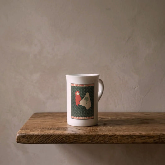 William H. Bradley: Christmas 1895 – porcelain art mug on an oiled oak shelf against a limewashed wall
