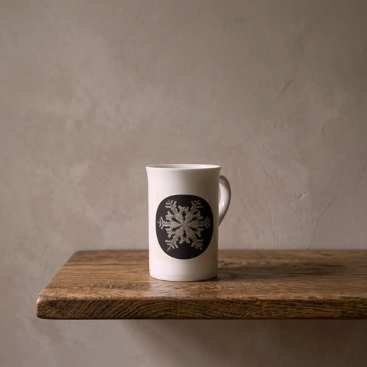 Wilson Bentley: Snowflake, c. 1905 – porcelain art mug on an oiled oak shelf against a limewashed wall