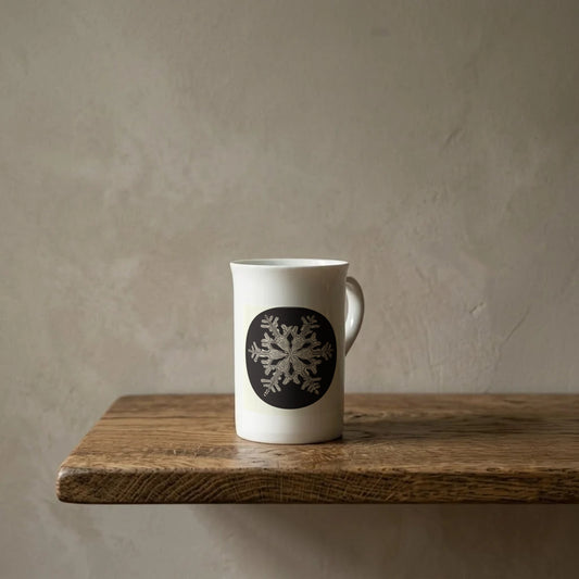 Wilson Bentley: Snowflake, c. 1905 – porcelain art mug on an oiled oak shelf against a limewashed wall